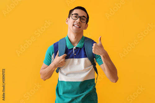 Male Asian student in eyegl...
