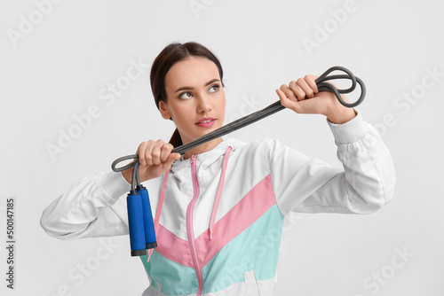 Sporty young woman with ski...