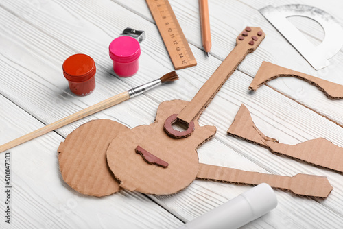 Cardboard guitar toy with m...