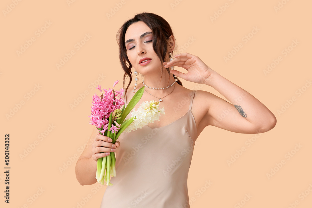 Pretty young woman with hyacinth flowers on color background Pretty young woman with hyacinth flowers on color background