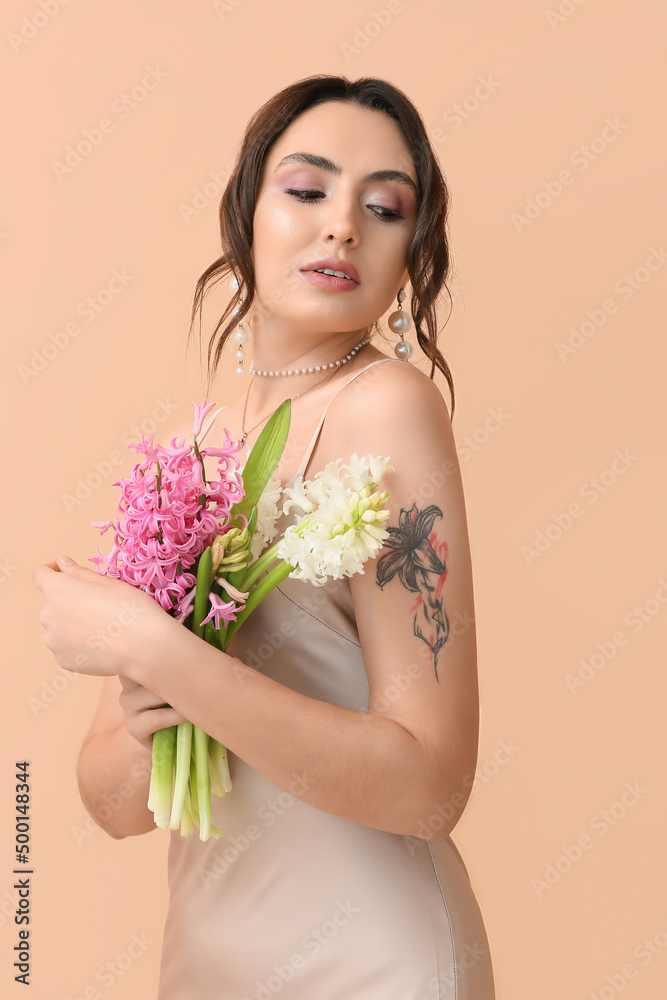 Pretty young woman with hyacinth flowers on color background Pretty young woman with hyacinth flowers on color background