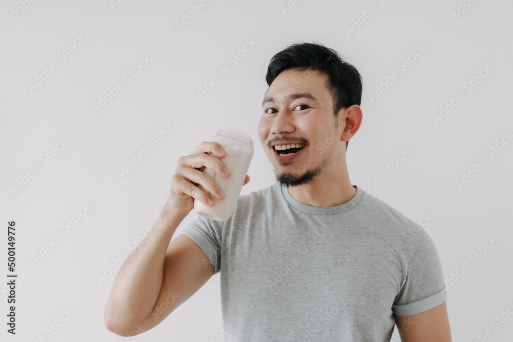 Happy asian man drink good taste healthy chicken protein shake recipe. Happy asian man drink good taste healthy chicken protein shake recipe.