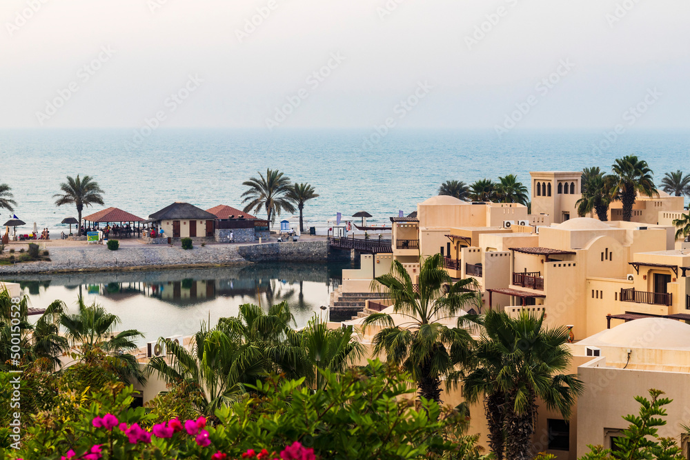 Ras Al Khaimah, UAE - 04.04.2022 - View of the beach and private villas at The Cove Rotana Resort. Holiday