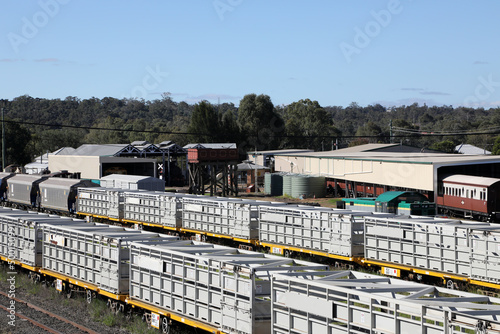 Railway yard and station in the Queensland town of Warwick in Southern Downs Region, featuring buildings, silos and carriages photo