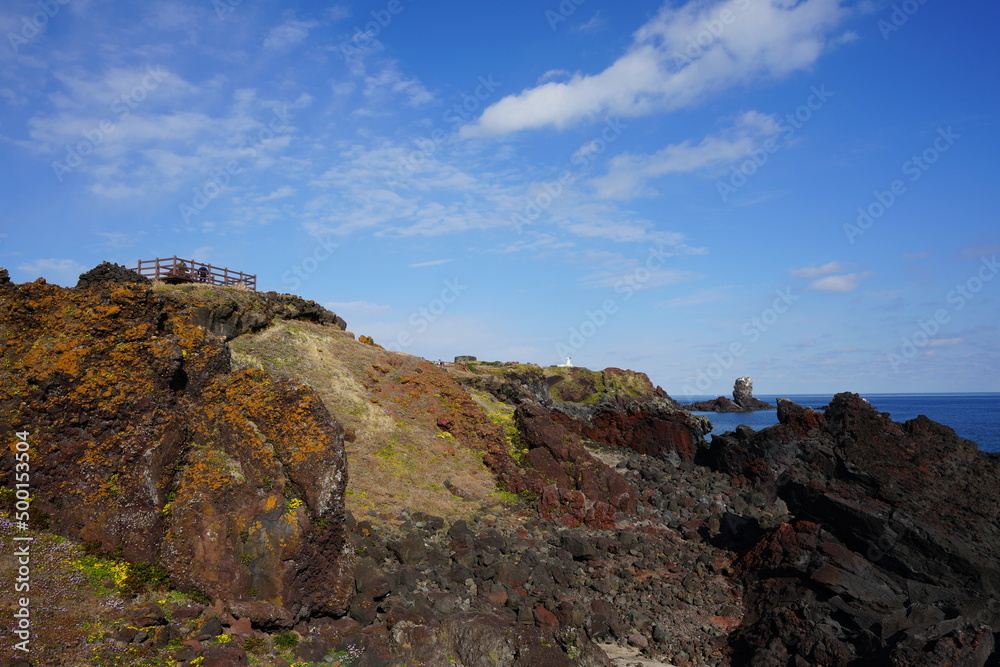 fine rock coast and charming clouds