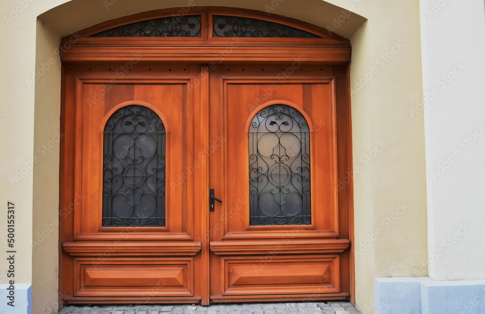  old  wooden door,wrought iron window in Bistrita,Romania