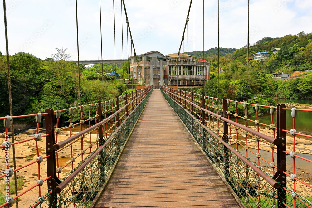 Obraz premium Suspension Bridge near Shifen Waterfall, a waterfall located in Pingxi District, New Taipei City, Taiwan