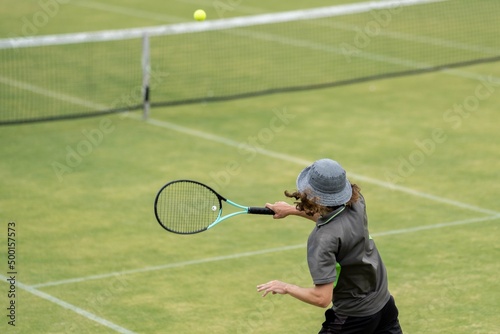Amateur playing tennis at a tournament and match on grass in Melbourne, Australia  © William