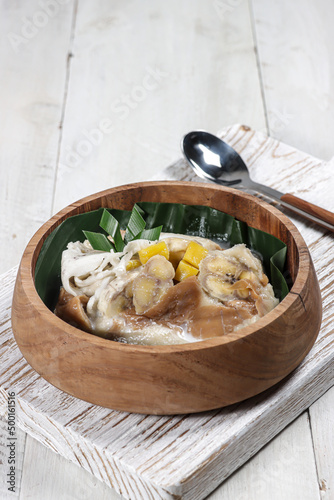 Pis kopyor or Bongko kopyor is traditional cake made from slice of banana, coconut, jackfruit and slice of bread with coconut milk soup. photo