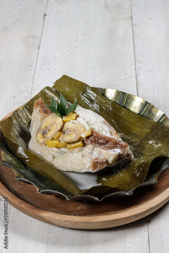 Pis kopyor or Bongko kopyor is traditional cake made from slice of banana, coconut, jackfruit and slice of bread with coconut milk soup. photo