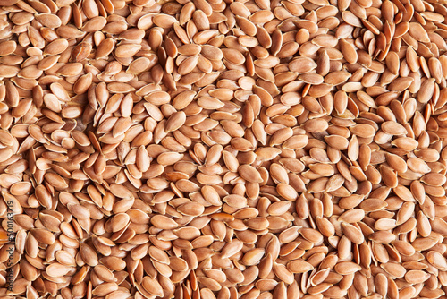 Flax seeds close-up. Macro photo. View from above. Flat lay.