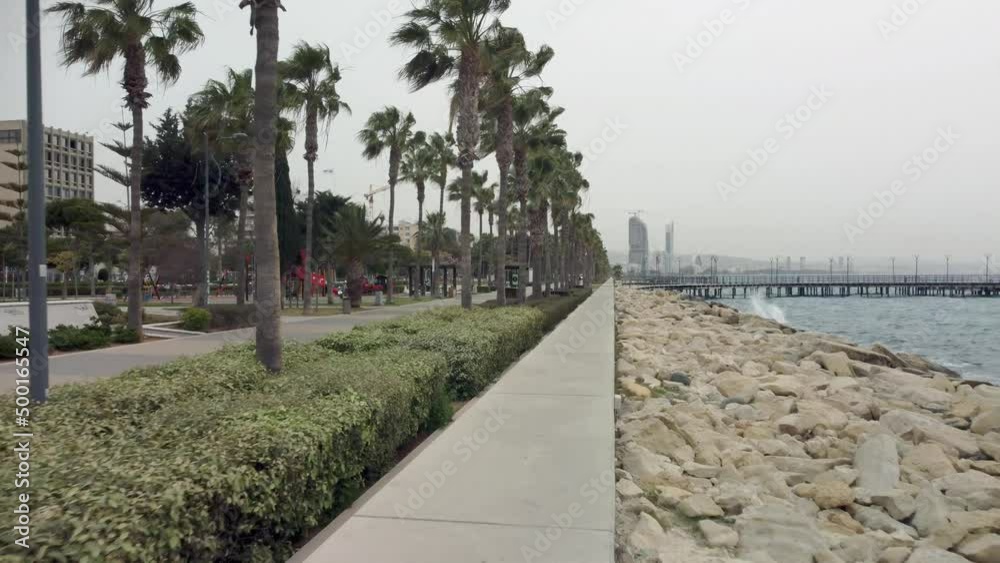 Drone flight over the Molos promenade in Cyprus in Limassol in the morning in windy weather in spring. Drone flight over the Molos promenade in Cyprus in Limassol in the morning in windy weather in spring.