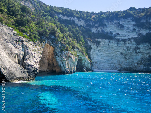 Beautiful view of the blue cave of Paxos island. The purest water with an amazing turquoise hue. Corfu, Greece