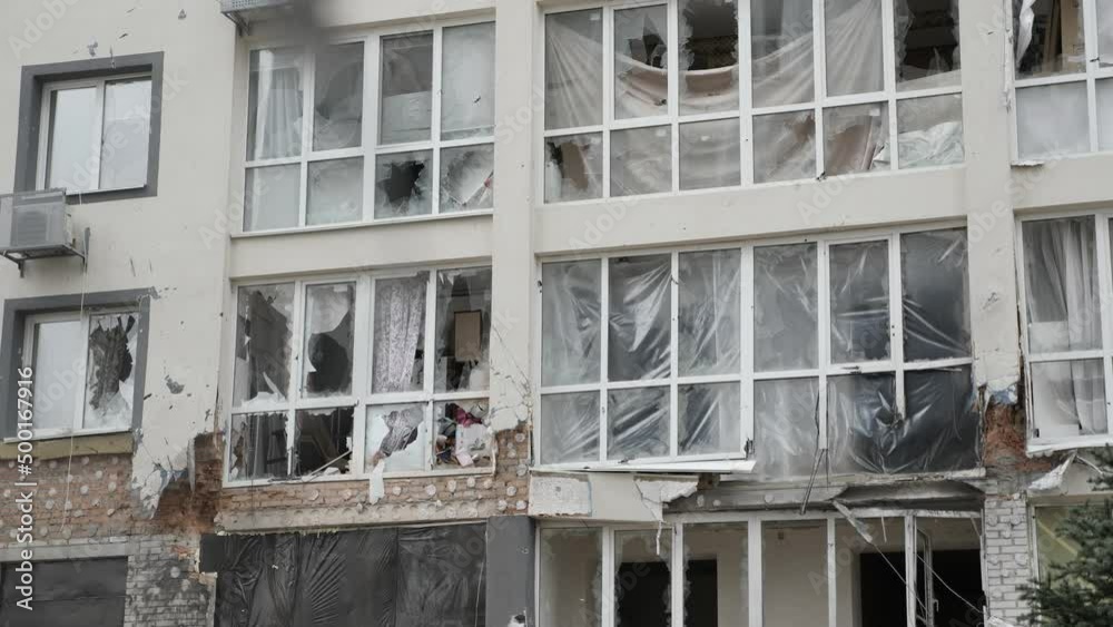 Aftermath shooting Ukraine shell civilian hitting building explosion glass. Shatter glass damage Ukraine war destruction building damage. Crash glass broken window house destroy building window crack