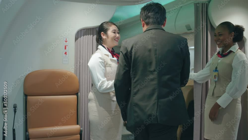 Air hostess is providing ticket checking service before boarding. Air hostess is providing ticket checking service before boarding.