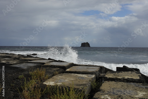 Stromboli: mare mosso.Onde sulle rocce di protezione per tsunami. photo