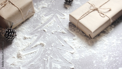 Draw a Christmas tree on the dough and presents made from recycled paper.