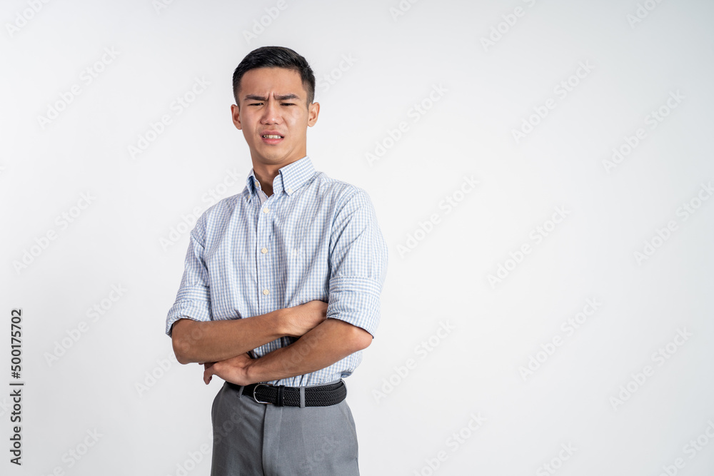 portrait of asian young man with disgusting expression isolated over white background portrait of asian young man with disgusting expression isolated over white background