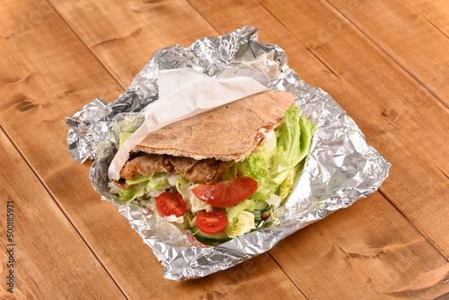 Doner kebab on aluminum foil. photo