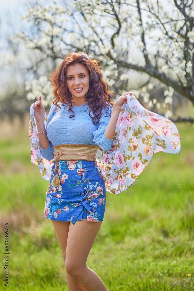 portrait of a beautiful brunette woman in spring nature. portrait of a beautiful brunette woman in spring nature.