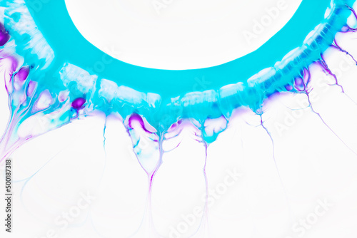 Fluid art texture. Abstract background with swirling paint effect. Liquid acrylic picture with flows and splashes. Mixed paints for baner or wallpaper. Turquoise, purple and white overflowing colors.