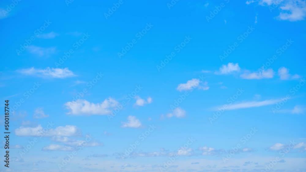 Blue sky with white cumulus clouds, timelapse. Bright sunny day with cloudy sky, time-lapse Blue sky with white cumulus clouds, timelapse. Bright sunny day with cloudy sky, time-lapse