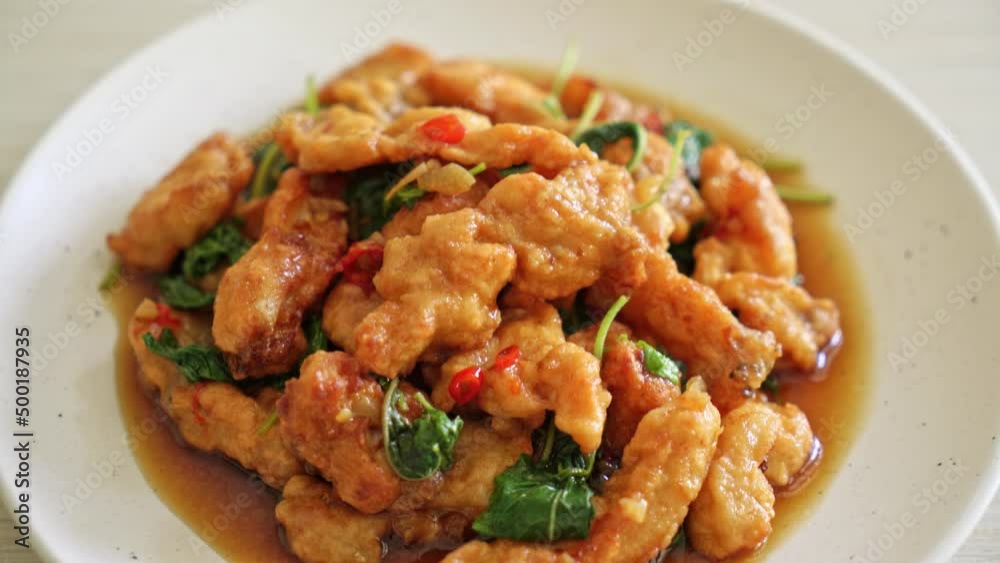 stir-fried fried fish with basil and chili in thai style - Asian food style stir-fried fried fish with basil and chili in thai style - Asian food style