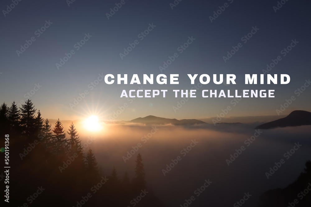 Motivational quote Change Your Mind Accept The Challenge. Text against foggy mountain landscape at sunrise - obrazy, fototapety, plakaty 
