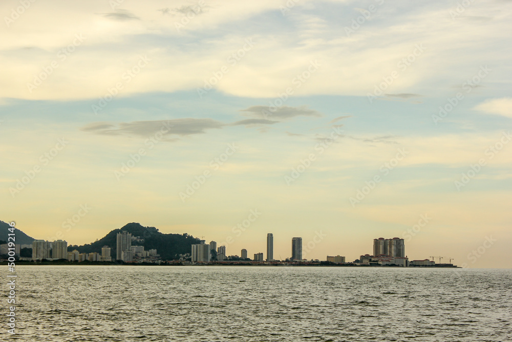 A view of the buildings across the sea in Georgetown from a waterfront in the island of Penang in Malaysia.