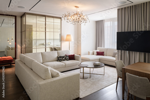 modern living room with large white sofa, luxury penthouse