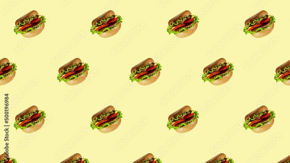 Minimal motion design - Tasty burgers rotating and moving down at yellow color background. Trendy colors and style graphics. Seamless looping animation. Minimal motion design - Tasty burgers rotating and moving down at yellow color background. Trendy colors and style graphics. Seamless looping animation.