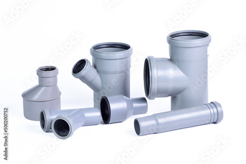 Plumbing fixtures and piping parts plastic fittings isolated on a white background