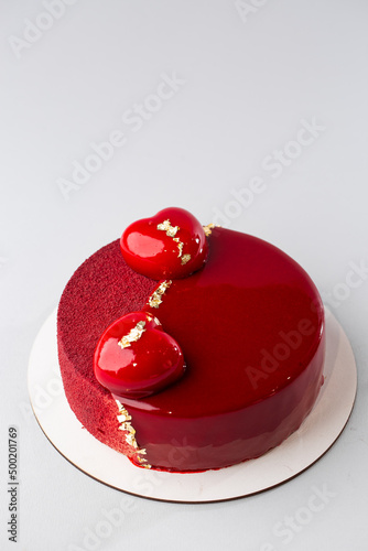 Red mirror half glazed and velor entremets with mini hearts and gold.