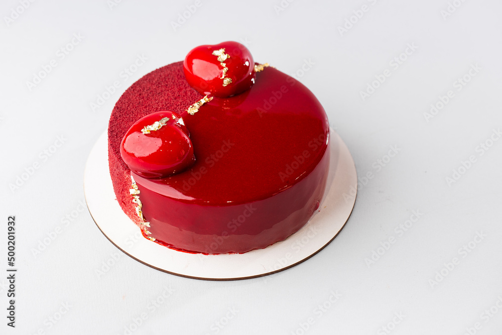 Red mirror half glazed and velor entremets with mini hearts and gold.