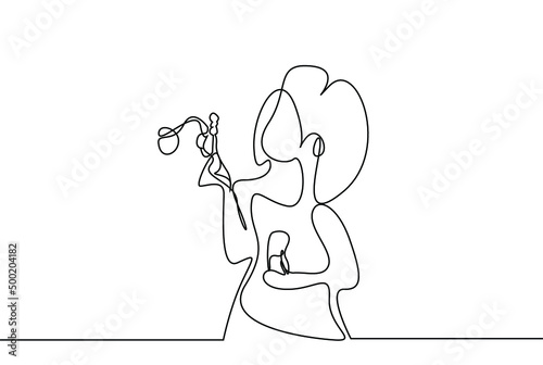 a girl is playing with bubbles from her lips