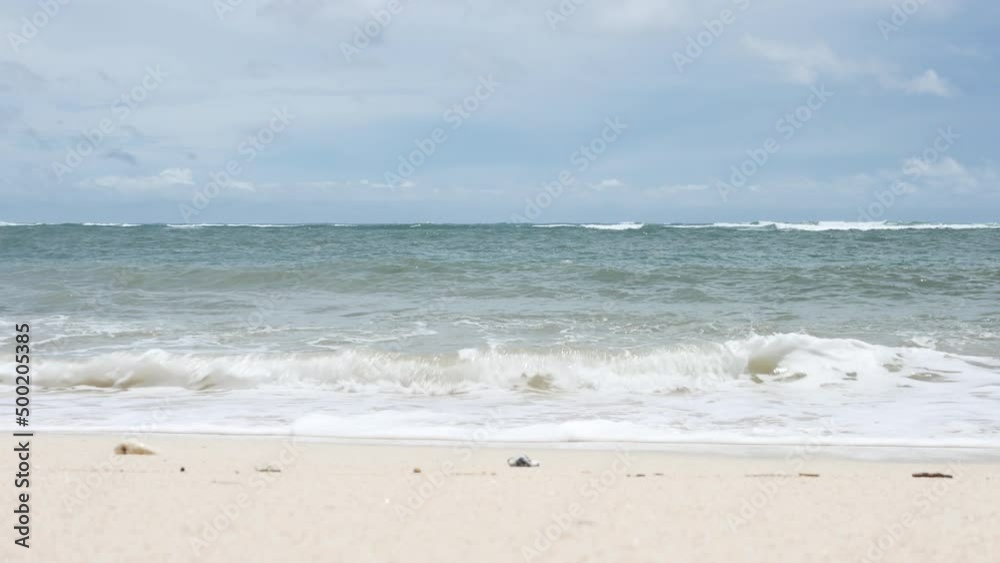 BALI, INDONESIA - JANUARY 22, 2018: Indian Ocean waves and sand on Pandawa Beach, Bali. 4K BALI, INDONESIA - JANUARY 22, 2018: Indian Ocean waves and sand on Pandawa Beach, Bali. 4K