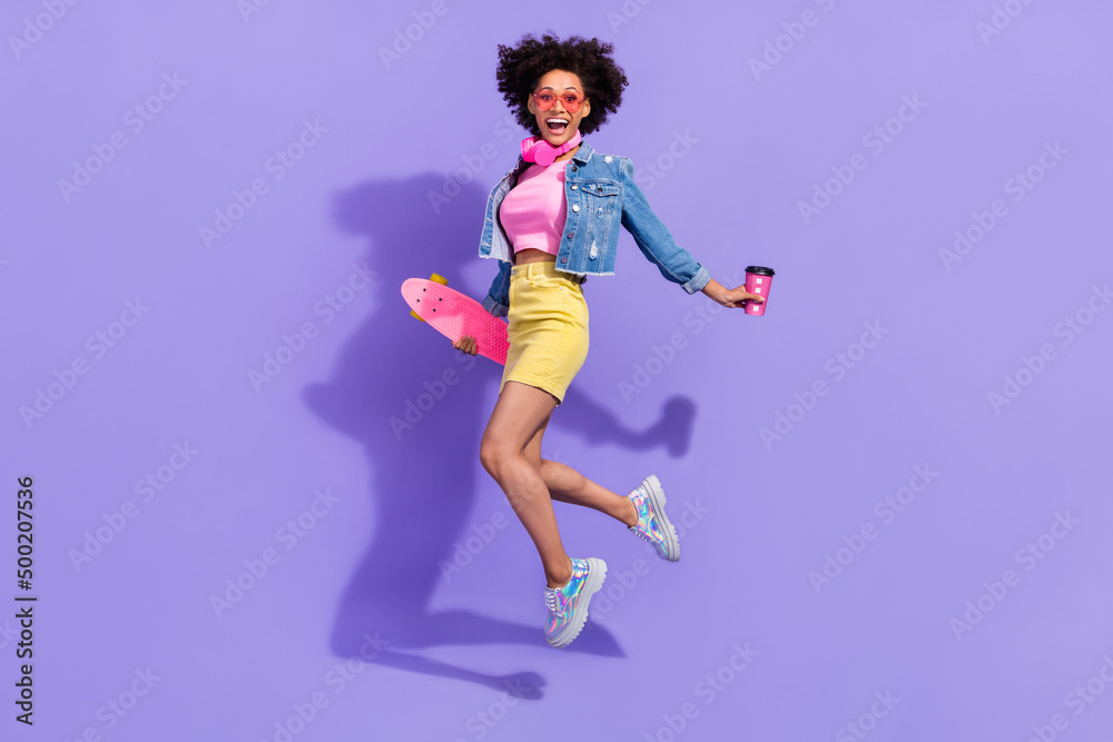 Full length body size view of attractive fit trendy girl jumping having fun action isolated on bright violet purple color background