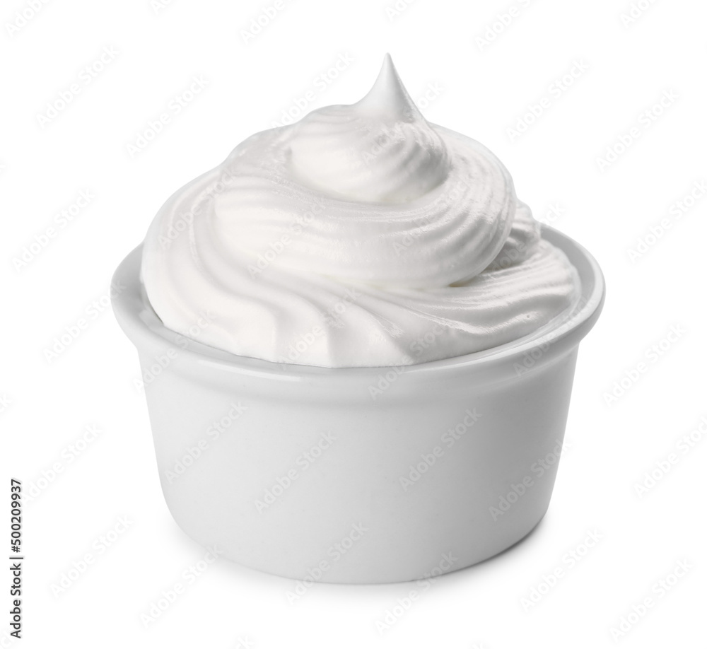 Fresh whipped cream in bowl isolated on white Fresh whipped cream in bowl isolated on white