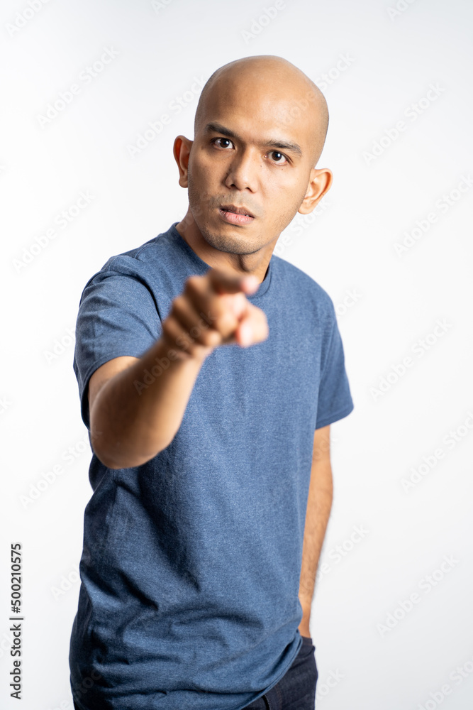 angry bald man with finger pointing forward on isolated background angry bald man with finger pointing forward on isolated background