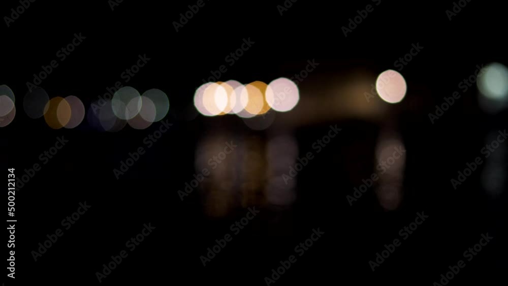 Abstract blurred aperture bokeh circles turn into city Abstract blurred aperture bokeh circles turn into city