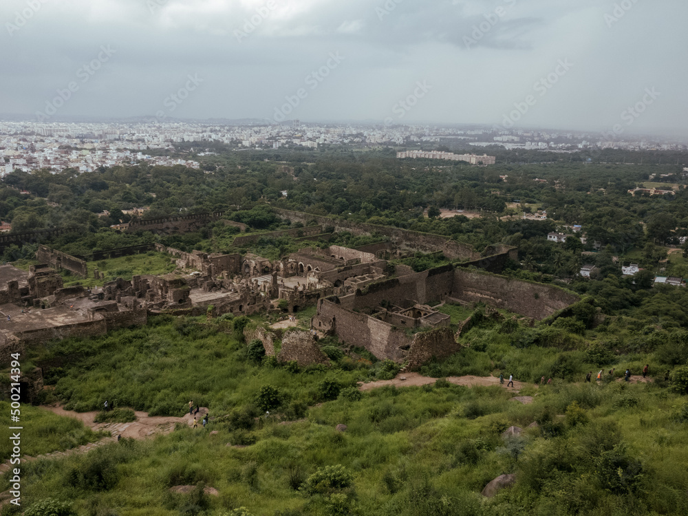 A panoramic view of the famous Golconda Fort situated in the South-Indian state of Hyderabad. The picture captures the wide fortress, lush gardens and adjoining cityscape of the Hyderabad city. 