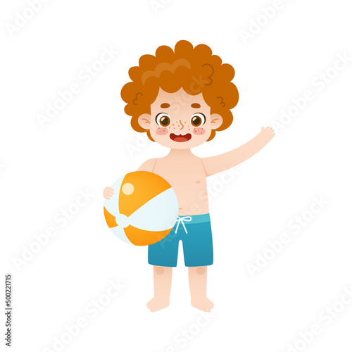 Cute little boy with beach ball standing and waving his hand. Adorable kid with red curly hair holding inflatable ball.