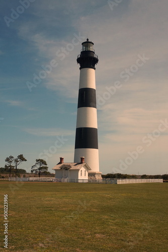 Black and White Horizontally Striped Body Island Lighthouse in Daylight