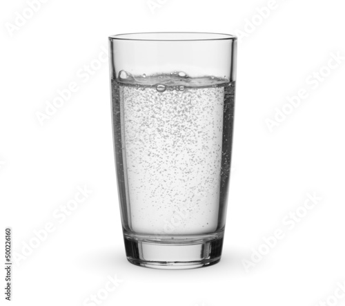 Glass of drinking carbonated sparkling water isolated