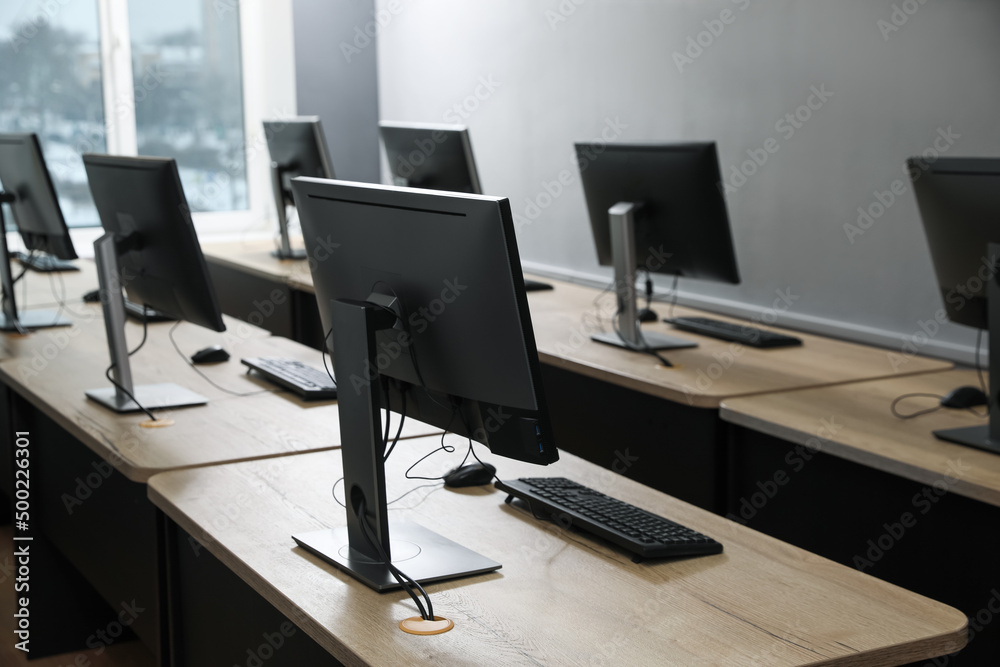 Many modern computers in open space office Many modern computers in open space office