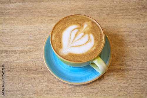 Hot cappuccino with a beautiful foam in an elegant ceramic cup