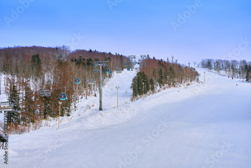 Yuzhno-Sakhalinsk, Russia - Jan 01, 2022: skiers in the slopes of the skiing resort Mountain Air.