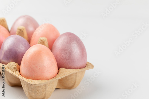 easter eggs in a basket on white background