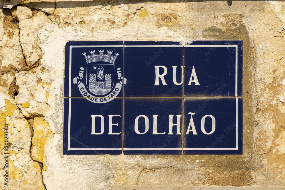 Fototapeta premium Old azulejos tiles on a facade in the village of Estoi, Algarve, Portugal