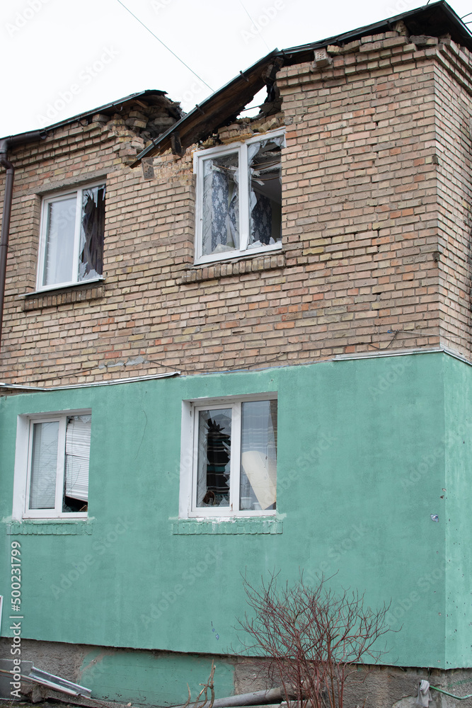 Gostomel, UKRAINE - April 19, 2022: War of Russia against Ukraine. Damaged by aircraft, shelling by the enemy residential building in Ukraine. Editorial
